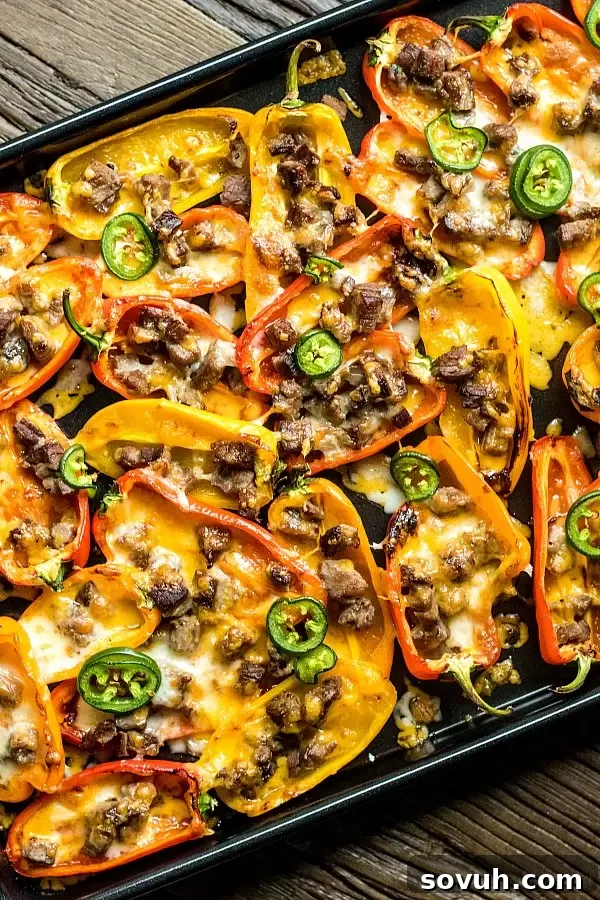 Low Carb Nachos made with colorful sweet peppers as the base, loaded with meat and cheese.
