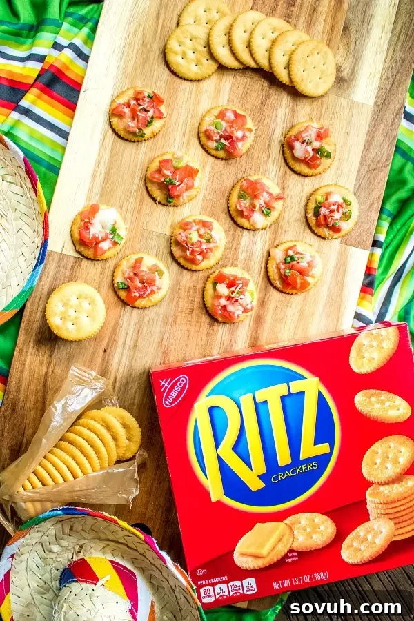 RITZ crackers topped with bruschetta and other appetizers on a party table