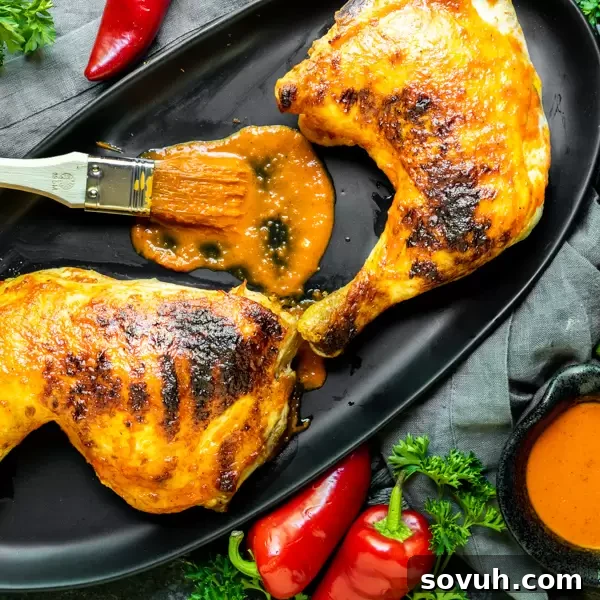 Homemade Peri Peri Chicken, a Nando's copycat recipe, marinated and grilled to perfection for a spicy, flavorful summer meal.