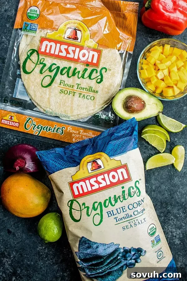 Sheet pan chicken fajitas with seasoning and fresh ingredients