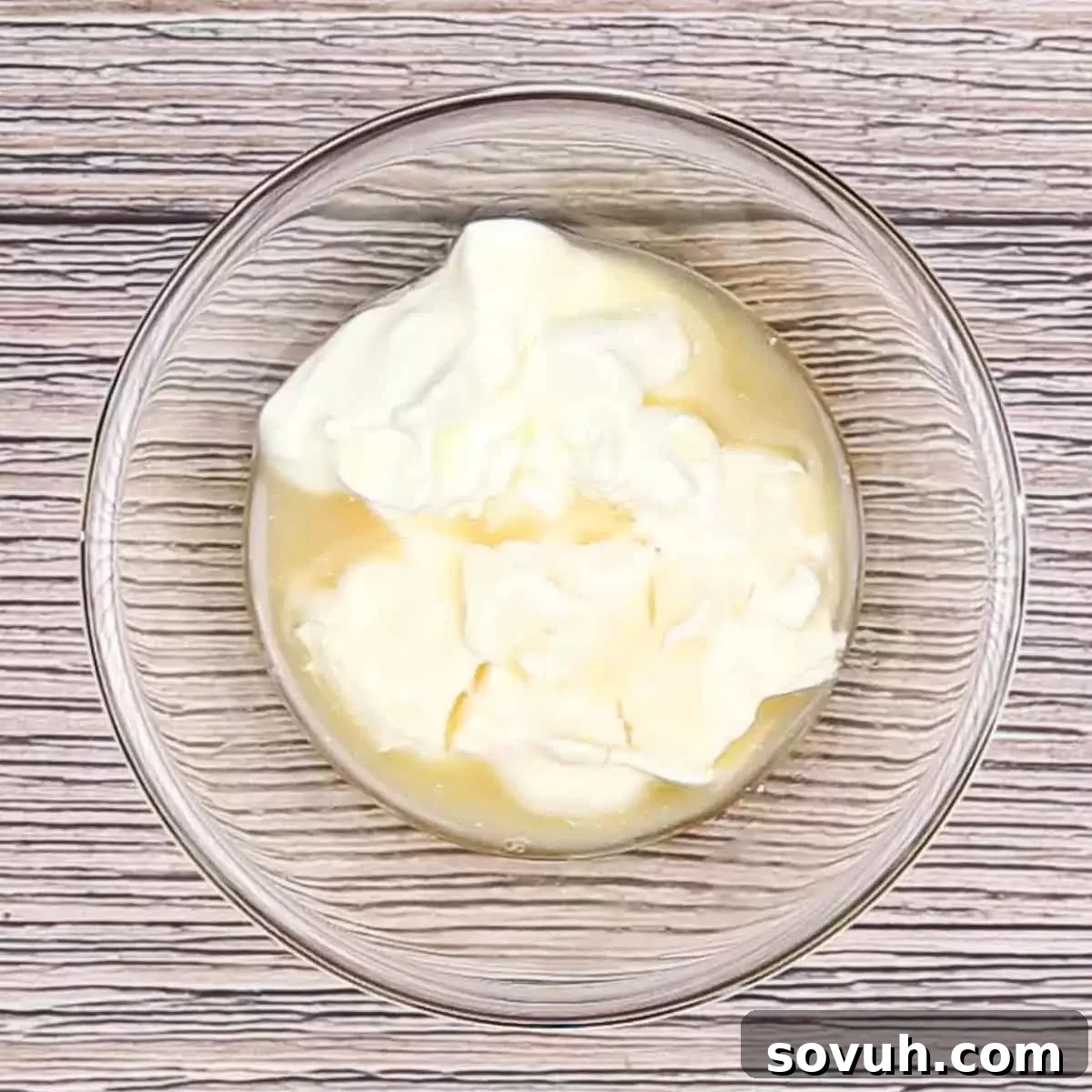 Velvety Spring Pea Salad 7 mixing the dressing for english pea salad in a glass bowl