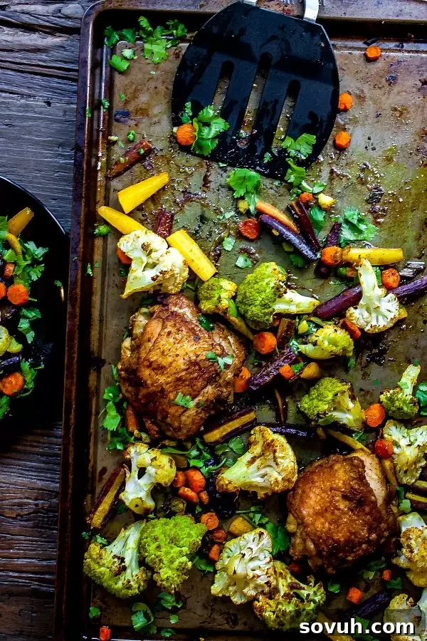 sheet pan with chicken curry and vegetable curry, fresh from the oven