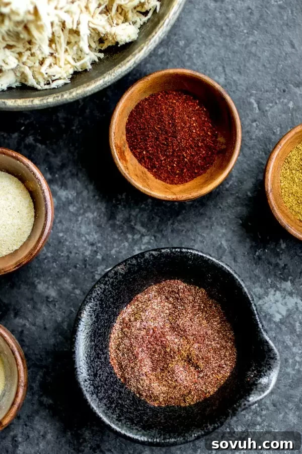 Artisan Taco Spice Blend 4 various spices laid out for taco seasoning preparation, including chili powder, cumin, paprika