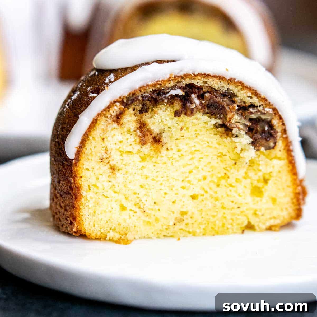 slice of Sock it to Me Cake on a white plate