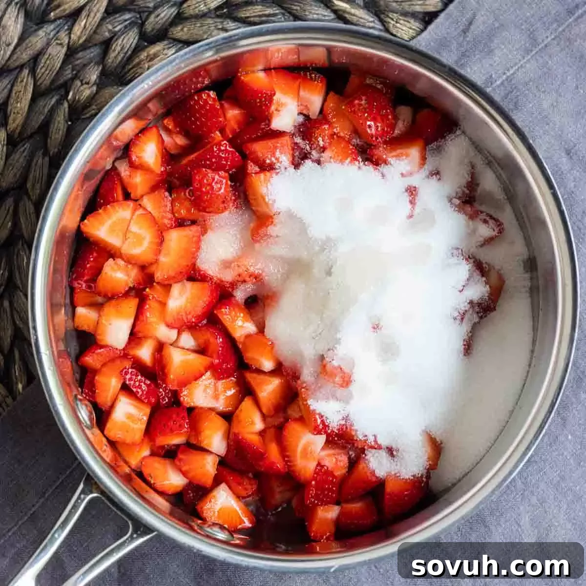 Pot with chopped strawberries and sugar to make Strawberry Coulis
