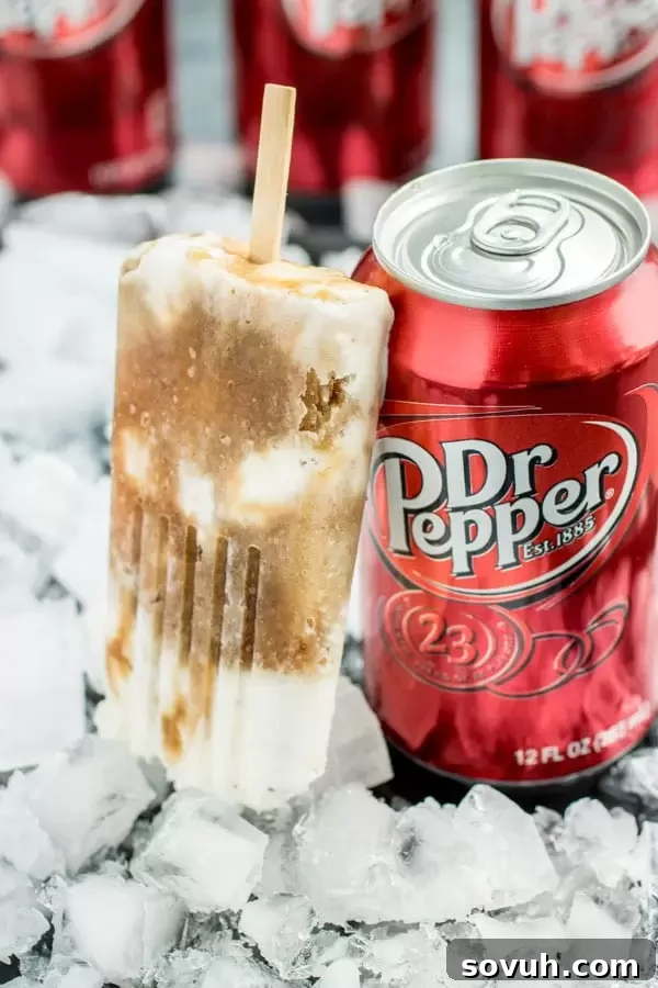 Dr. Pepper Popsicles displayed next to a can of Dr. Pepper, emphasizing the key ingredient.