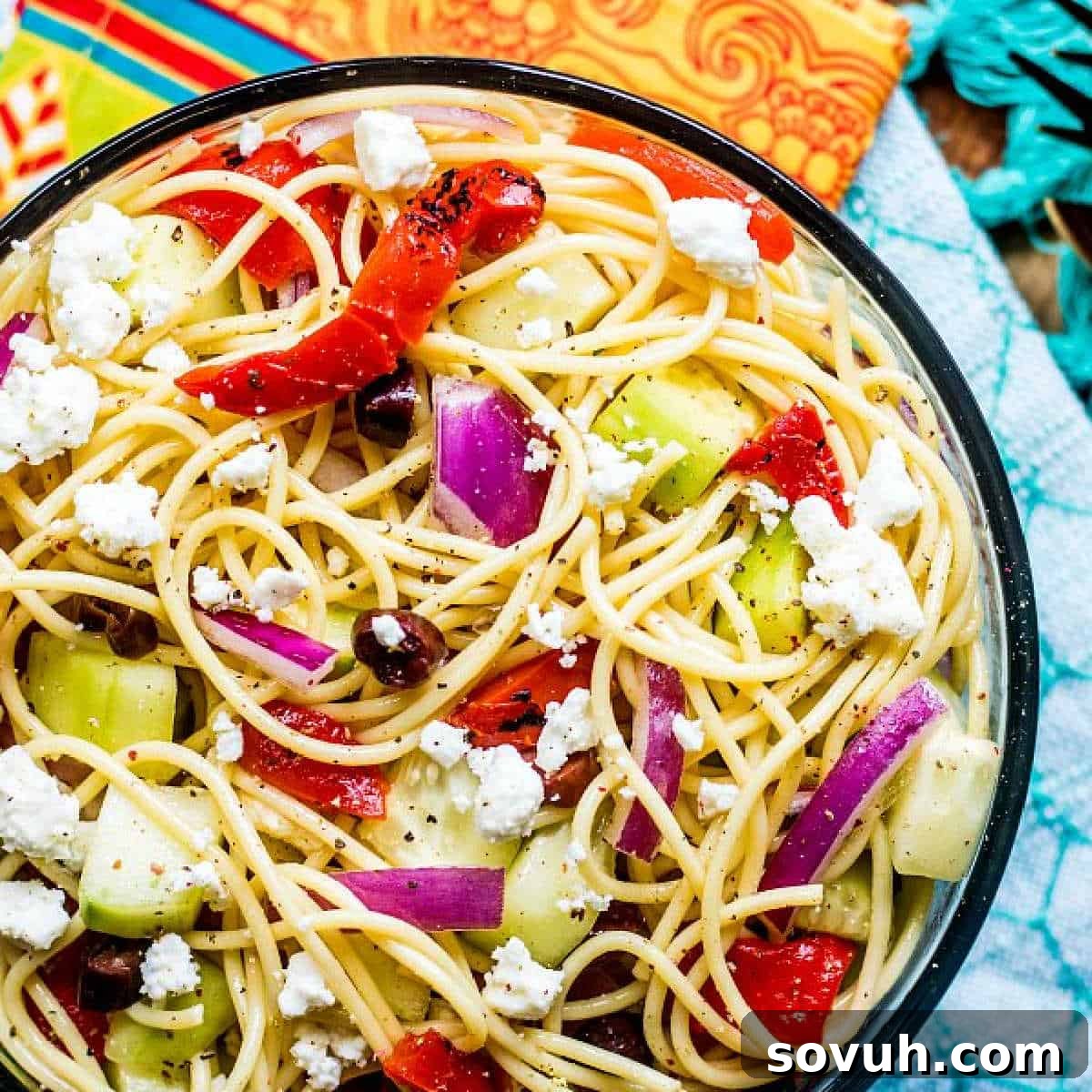 glass bowl of Greek Spaghetti Salad