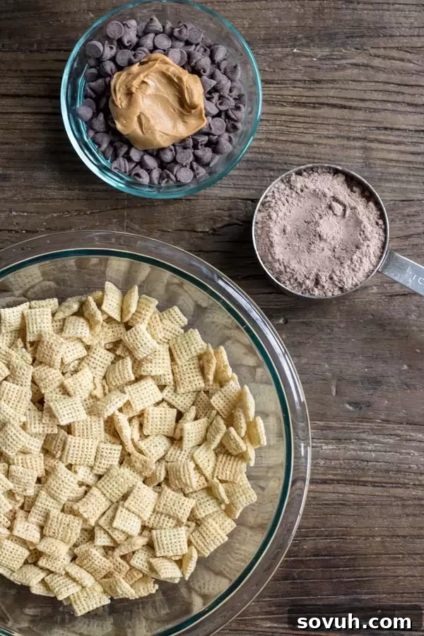 Ingredients laid out for making Werewolf Chow, including cereal, chocolate chips, peanut butter, brownie mix, and various Halloween candies