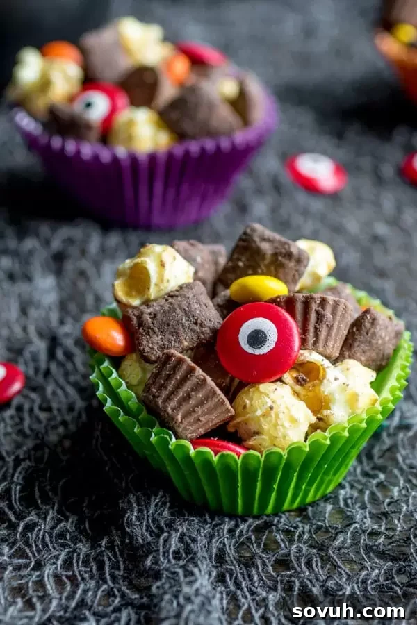 A handful of Werewolf Chow in a treat bag, showing the variety of ingredients and edible candy eyes.