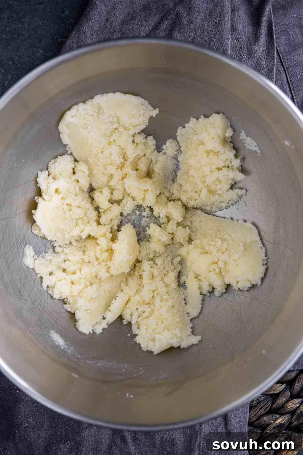 Creamed butter and sugar in a mixing bowl, forming the base for Ranger Cookies dough