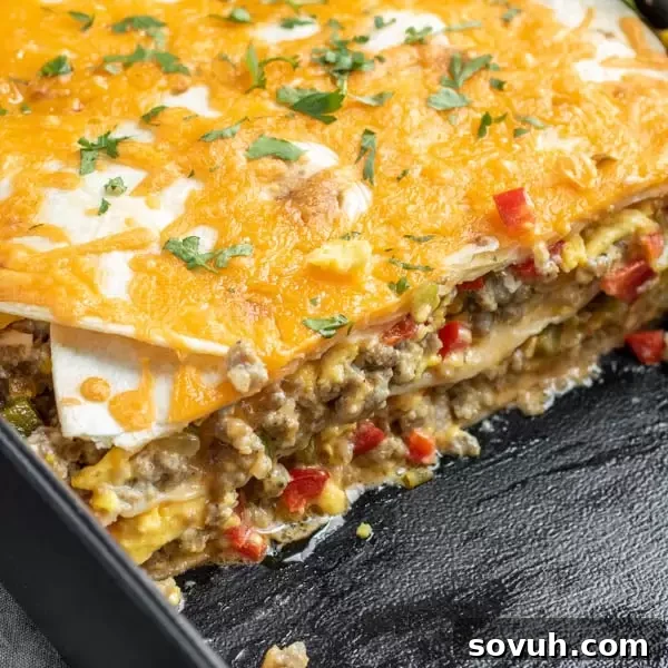 Delicious layers of Breakfast Burrito Casserole ready to bake