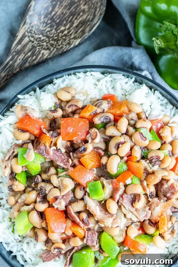 Instant Pot Hoppin' John presented in a rustic bowl with a wooden spoon, ready to be served.