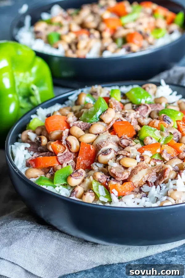 A serving of Instant Pot Hoppin' John ready to be enjoyed in a black bowl.
