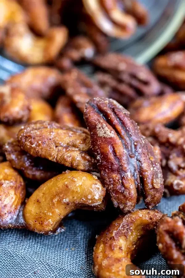 Close up of sweet and spicy slow cooker spiced nuts, showing their delicious sugary coating and a hint of spice.