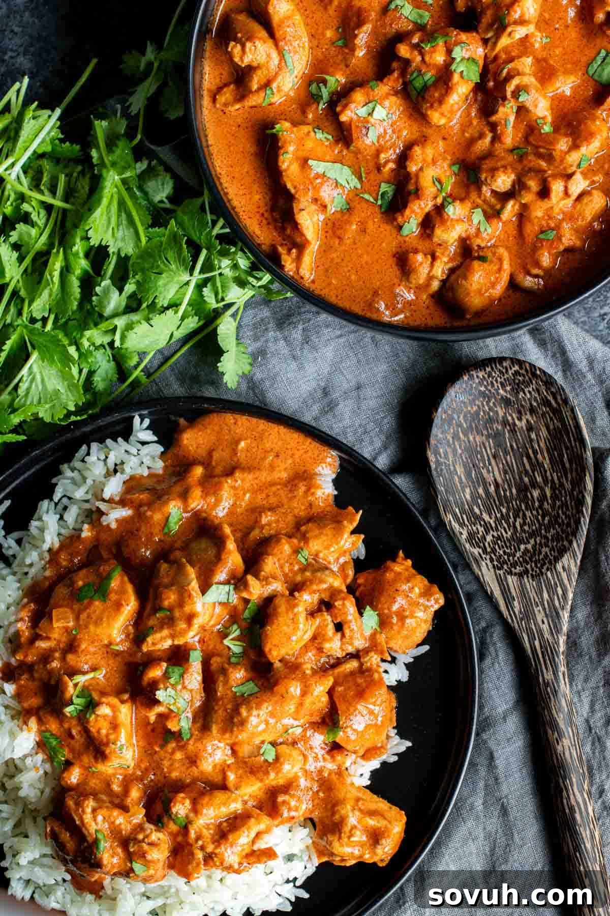 Two bowls of Instant Pot Keto Butter Chicken, garnished with herbs, and a pot with melted butter, representing the rich flavors.