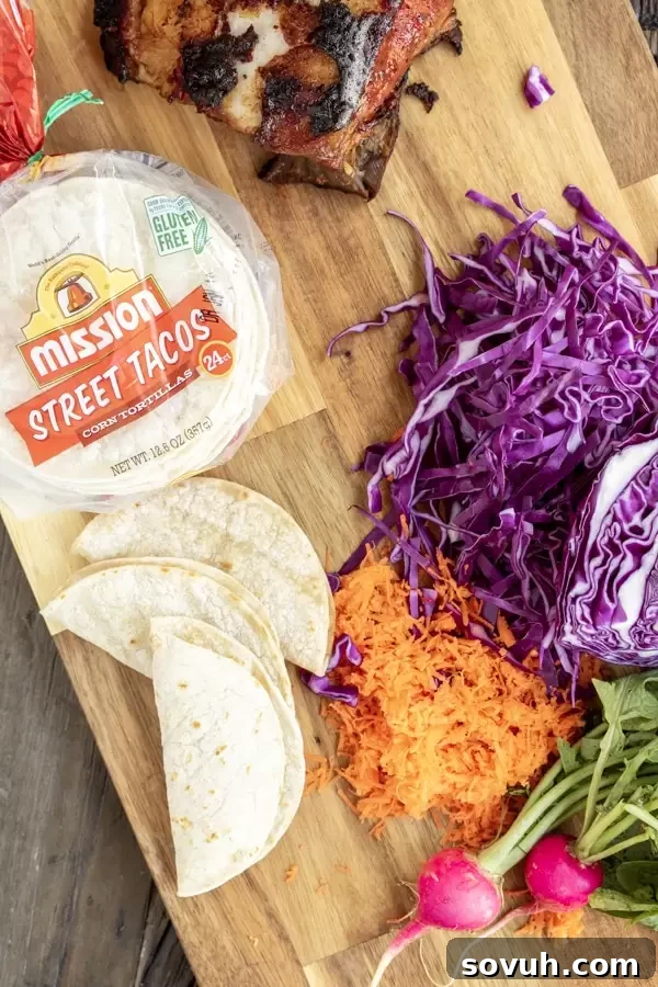 Ingredients laid out for Instant Pot Pork Belly Tacos, including Mission Street Tacos Corn Tortillas, pork belly, seasoning, and sauce.