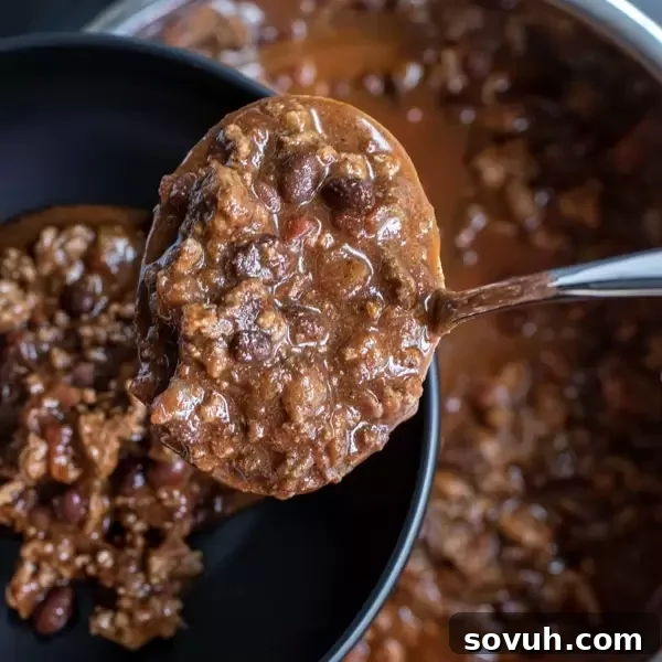 serving Instant Pot Chili in a bowl with toppings