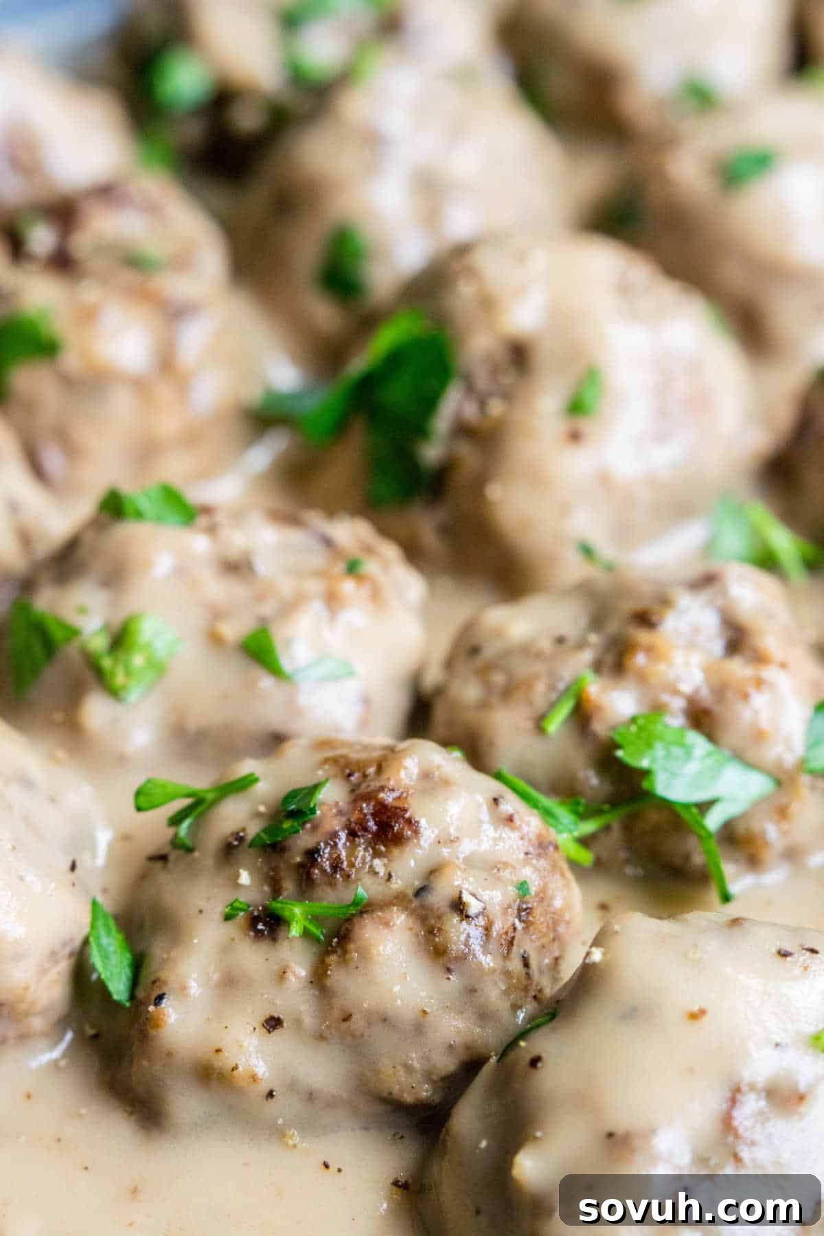 close up of swedish meatball sauce on meatballs