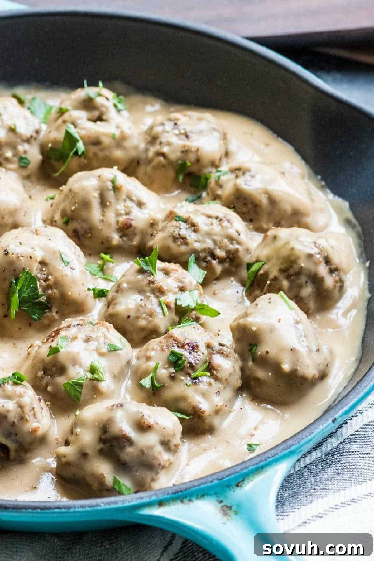 Cast iron pan with swedish meatballs in Swedish meatball sauce