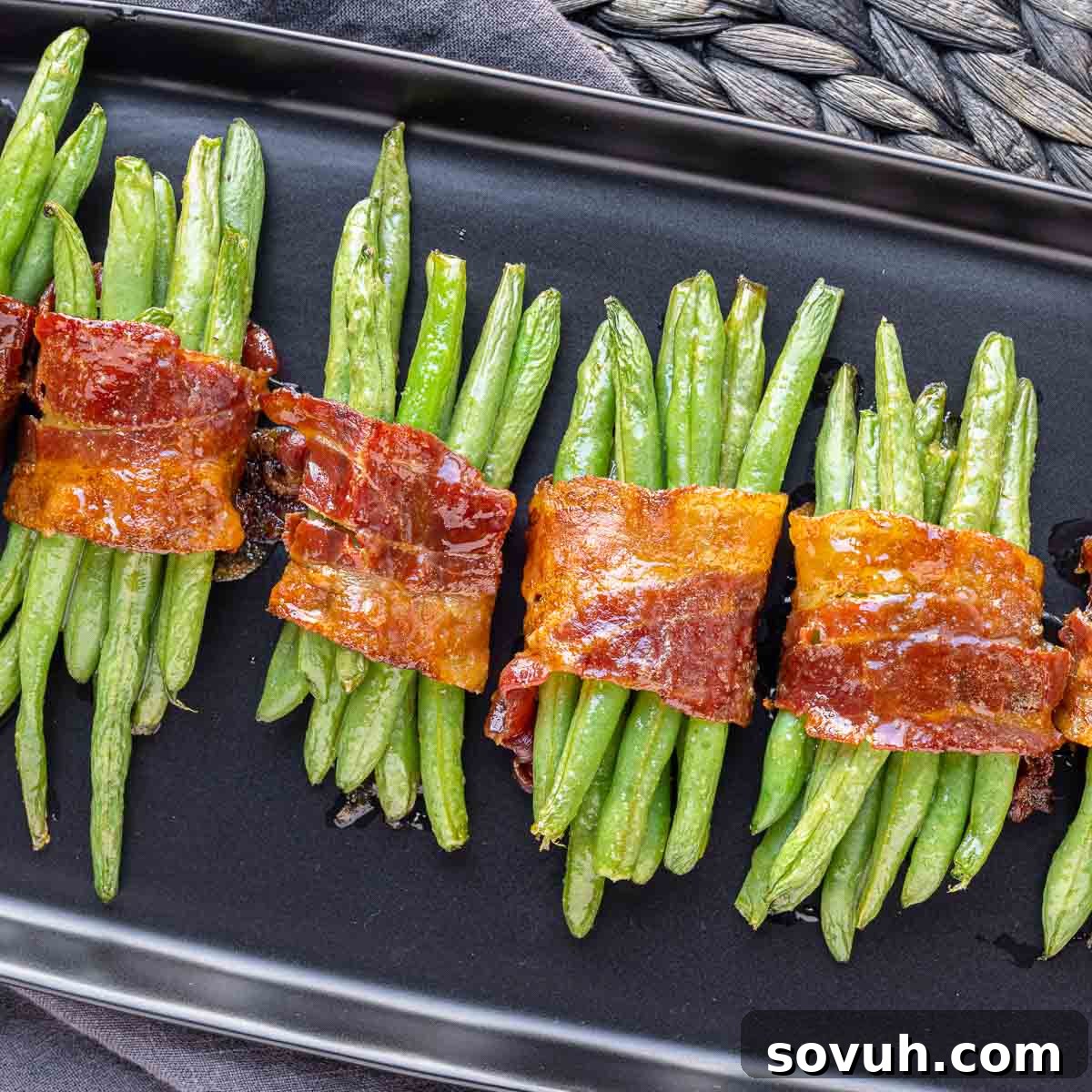Bacon Wrapped Green Beans on a black platter