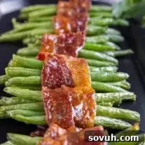 Bacon Wrapped Green Beans on a black platter