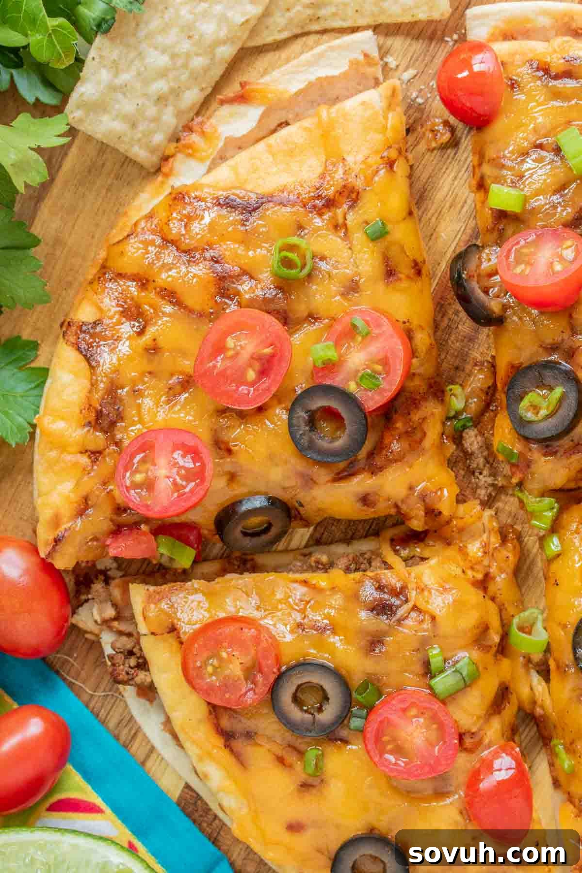 sliced Taco Bell Mexican Pizza with tomatoes