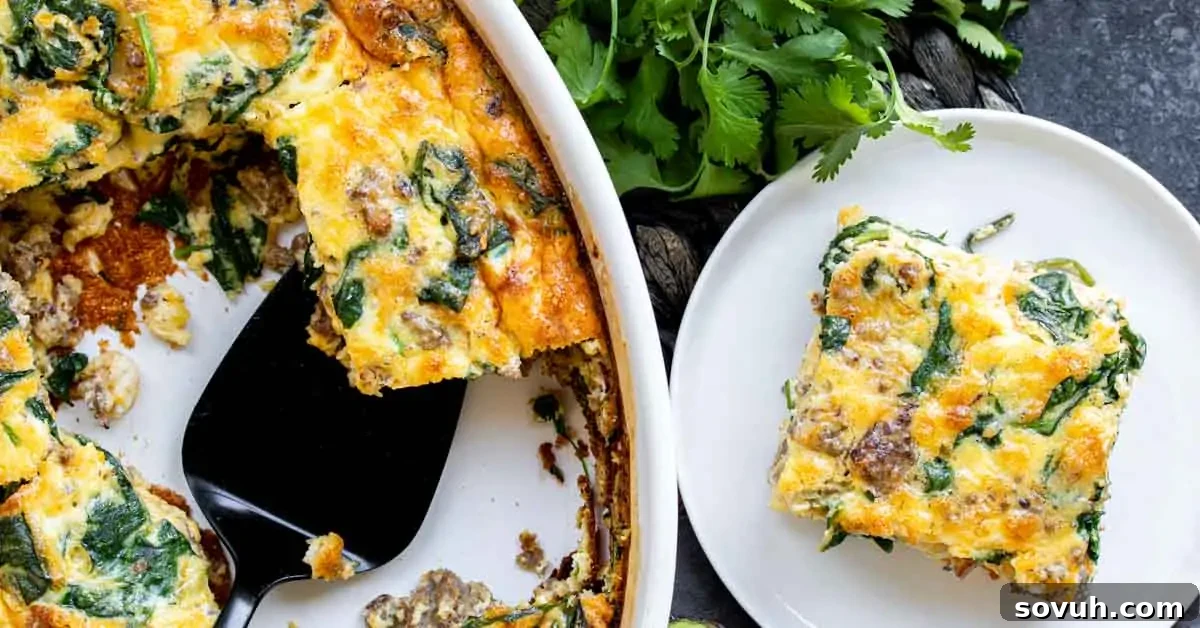 A beautifully baked slice of Sausage and Spinach Crustless Quiche on a white plate, with the remaining quiche in a white baking dish in the background. It highlights the golden-brown top and visible ingredients.