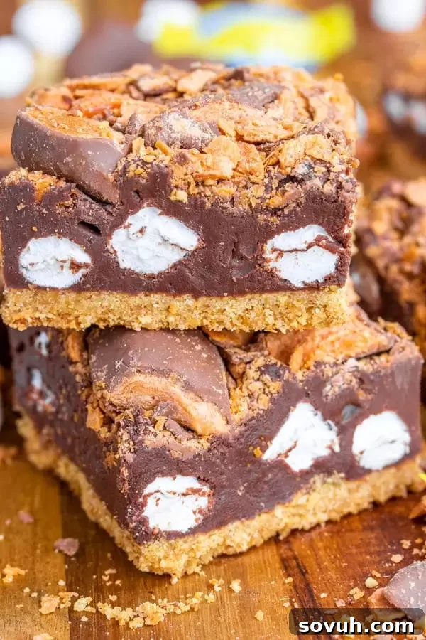 Close-up of a stack of Butterfinger S'mores Bars, showing the irresistible combination of layers and textures