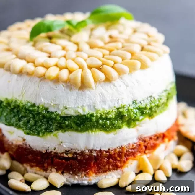 Pesto Cream Cheese Spread layers with pine nuts, inviting and fresh