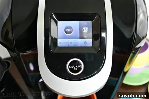 Close-up view of the digital touchscreen display on the Keurig 2.0 brewing system, showing brew options.