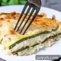 A delicious serving of Chicken Alfredo Zucchini Lasagna, ready to eat.