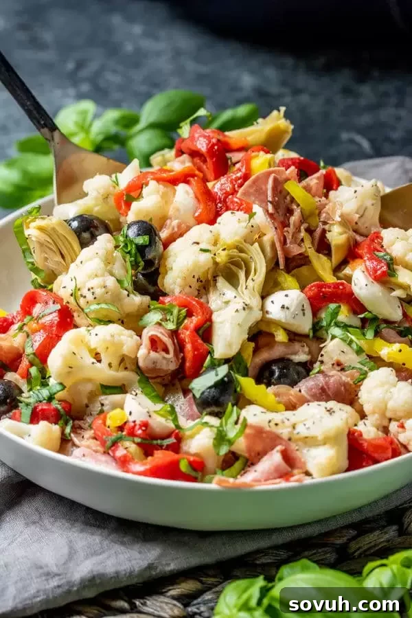 Keto Antipasto Salad tossed in homemade dressing