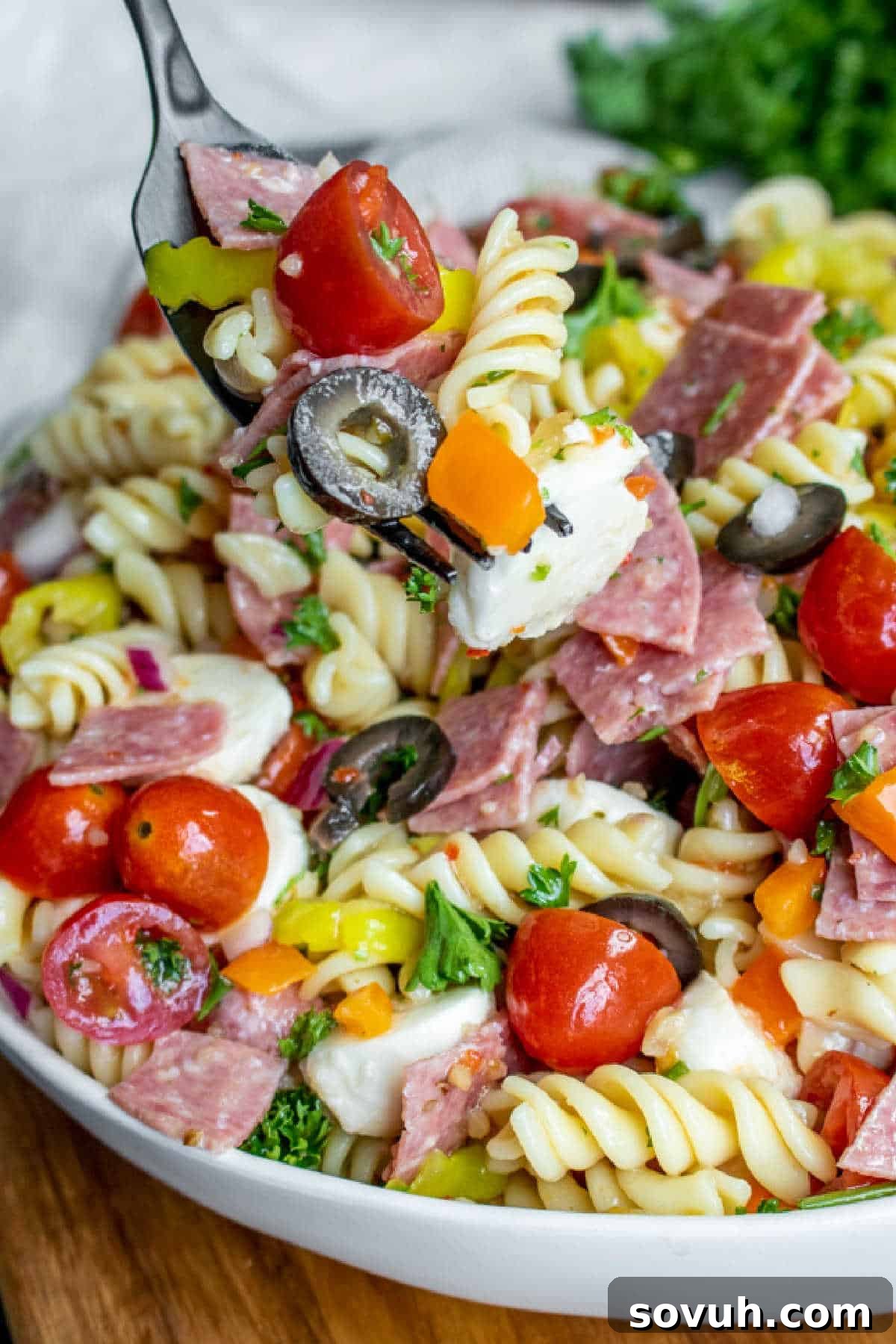 Italian Pasta Salad on a fork, ready to be eaten