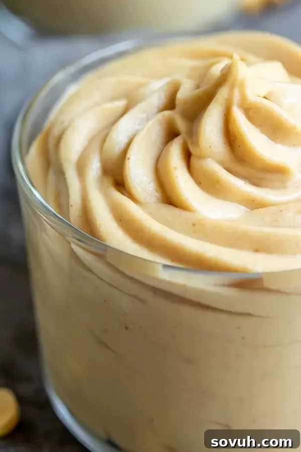 Keto Peanut Butter Mousse is a creamy low carb treat in a clear glass