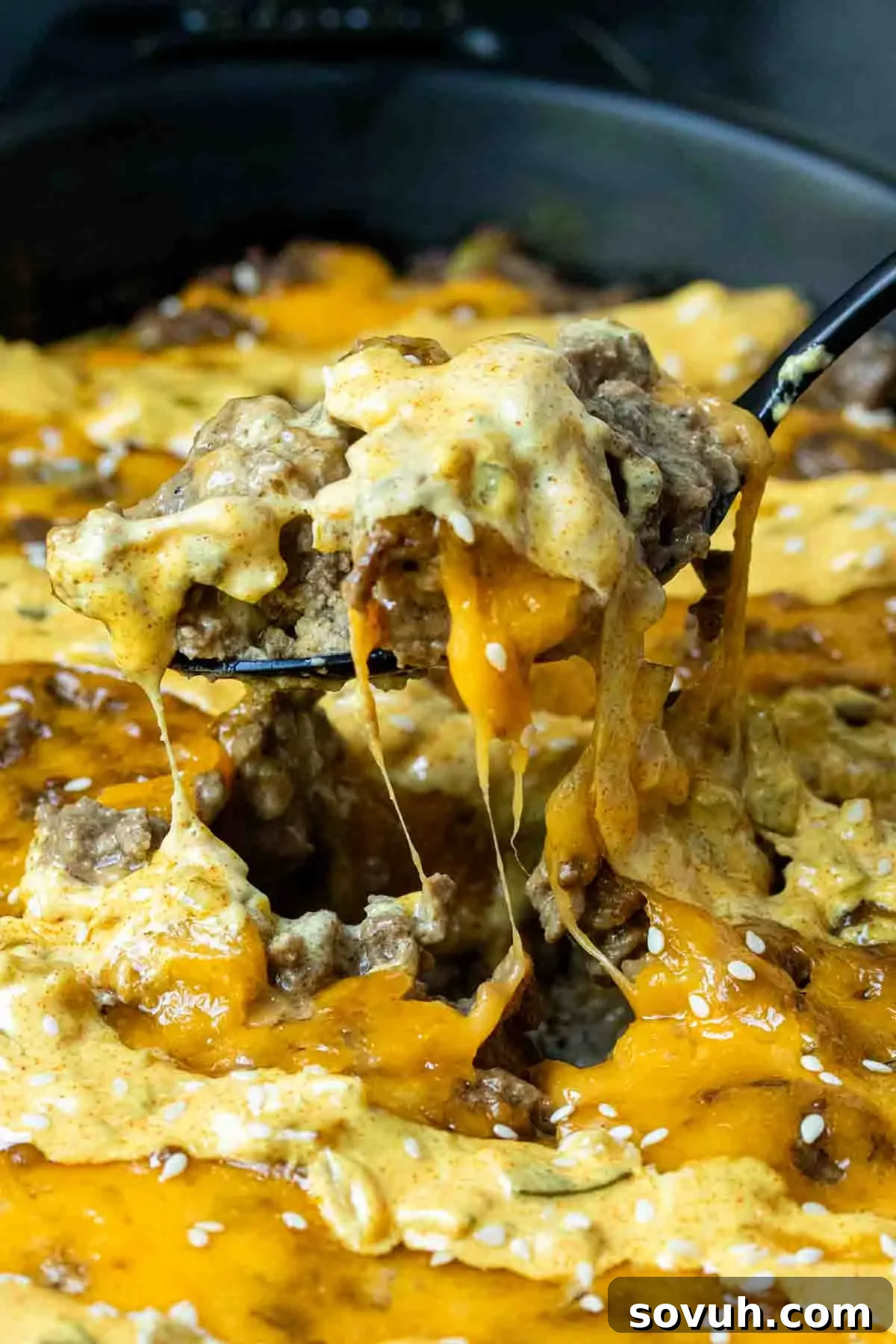 Big Mac Keto Bake 4 A close-up shot of a skillet filled with Keto Big Mac Casserole, topped with melted cheese and ready for the special sauce.