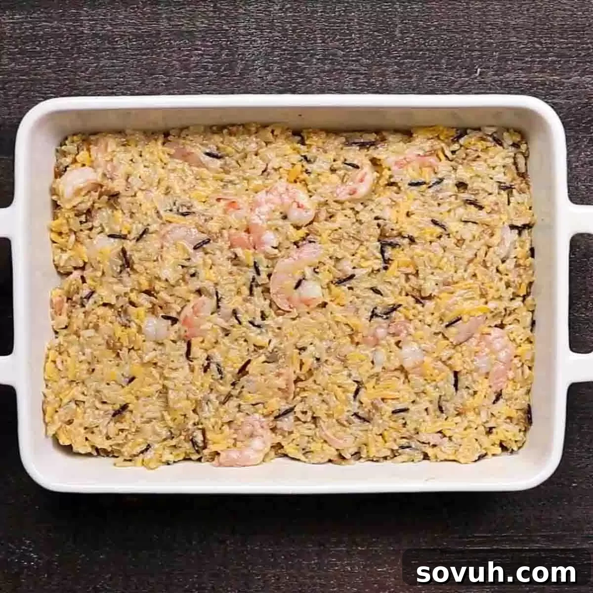 casserole dish with shrimp casserole mixture before baking