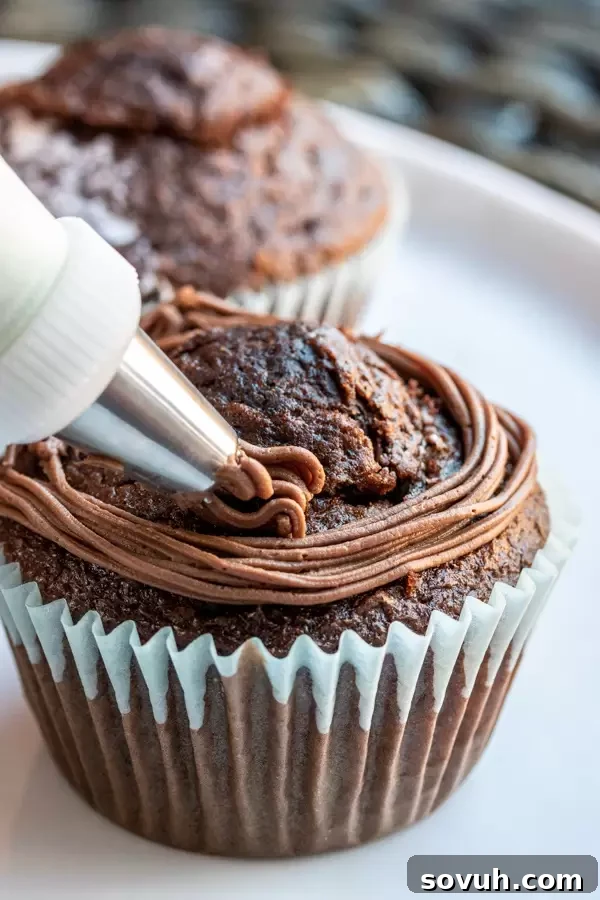 How to frost Bird’s Nest Easter Cupcakes, showing the piping technique to create the nest