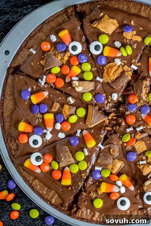 Close-up of a slice of Halloween Dessert Pizza on a white plate