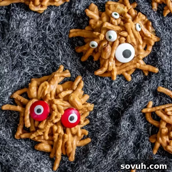 A platter of Halloween party dessert, No Bake Monster Cookies, adorned with spooky edible eyes.