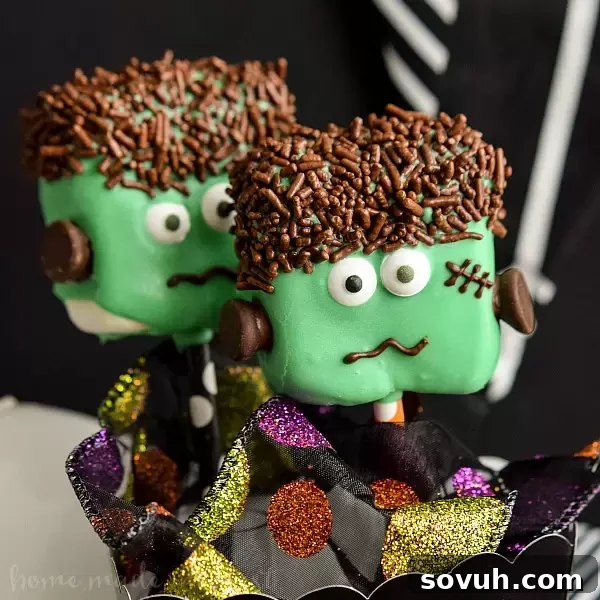 Playful Frankenstein Marshmallow Pops, neatly arranged in a box.