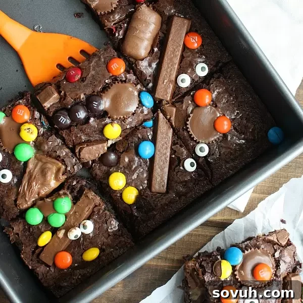 A spatula lifting a rich brownie square out of a pan, showcasing its delightful texture.