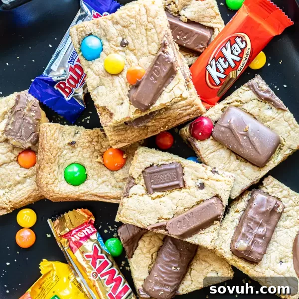 Delicious Candy Bar Cookie Bars, featuring an assortment of fun-size candy bars.