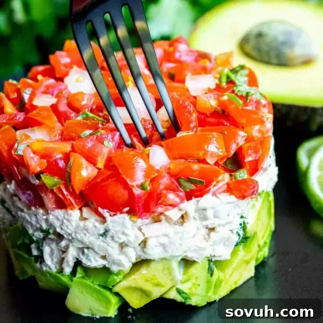 black fork going into Avocado Tuna Salad
