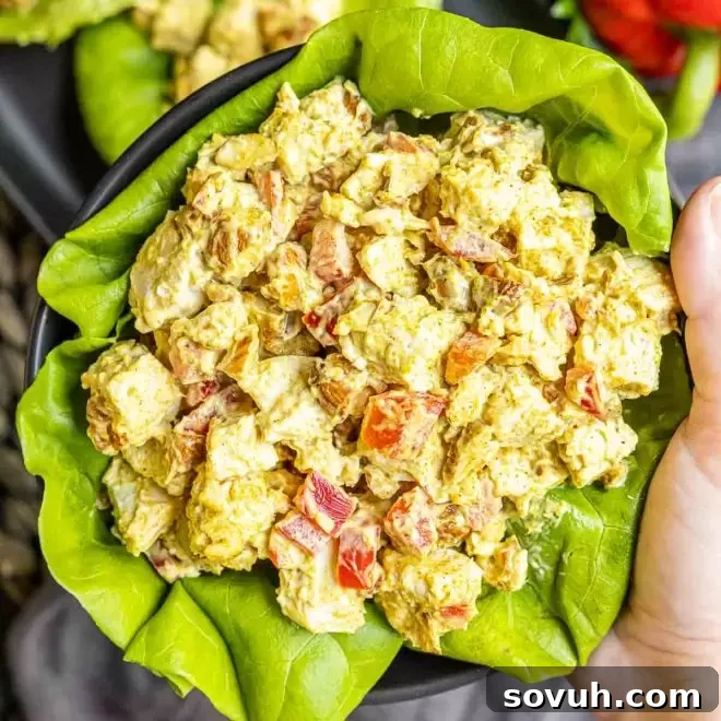 holding a bowl of Curry Chicken Salad