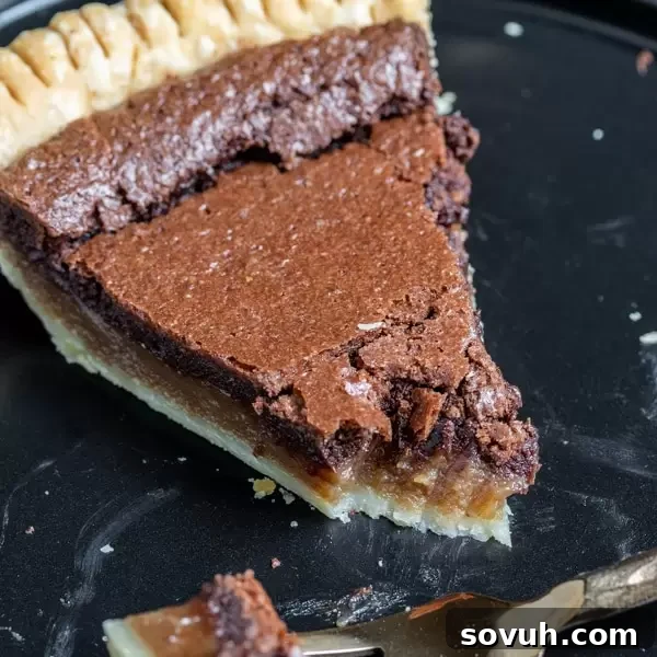 slice of Chocolate Chess Pie on a plate, ready to be enjoyed