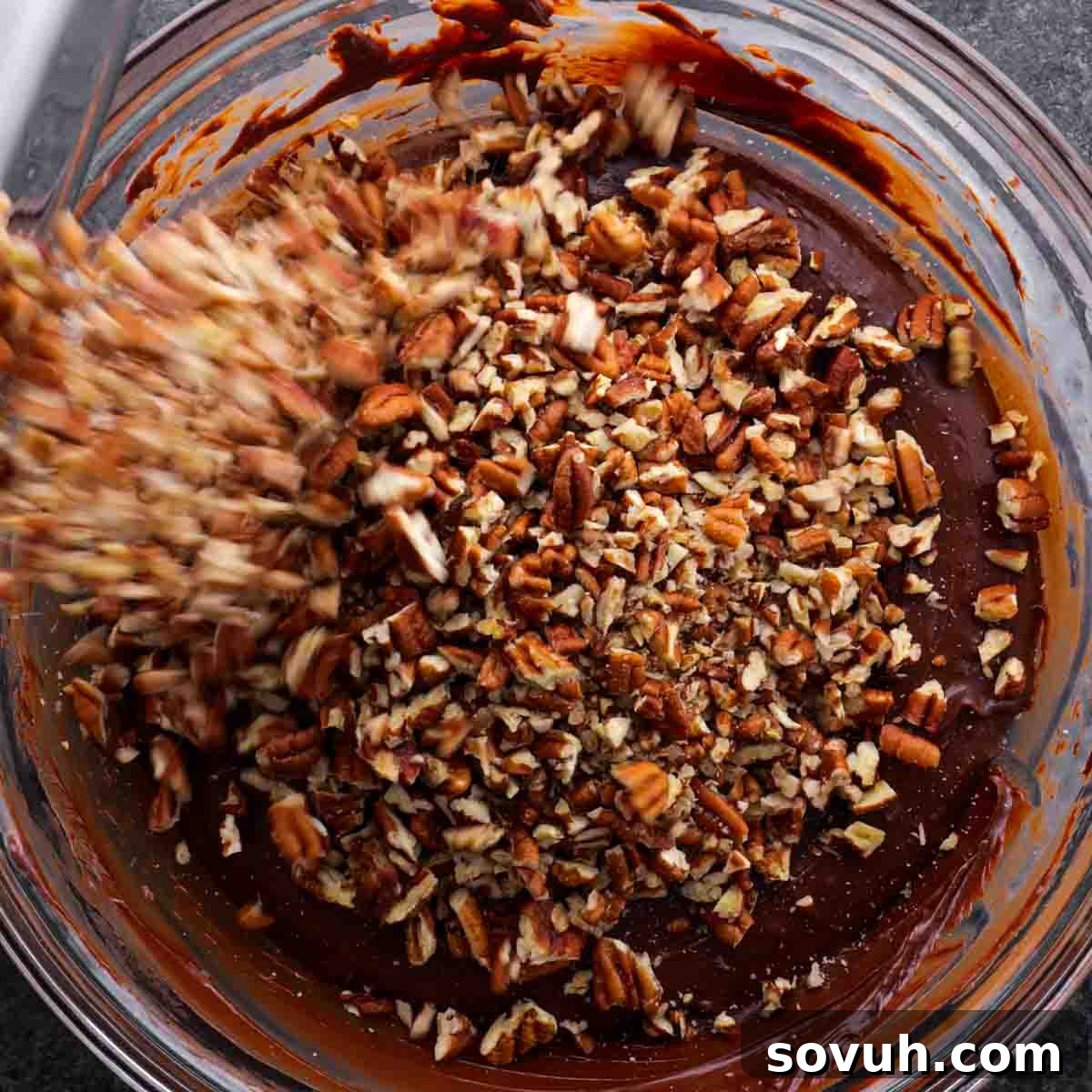 Easy Microwave Fudge with chopped pecans and melted chocolate chips