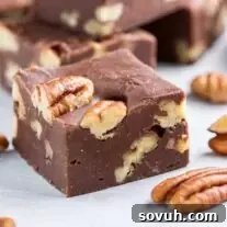 Easy Microwave Fudge with chopped pecans on parchment paper