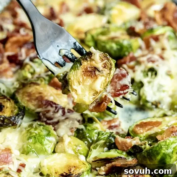 Cheesy Bacon Brussels Sprouts on black fork