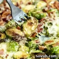 Cheesy Bacon Brussels Sprouts on black fork