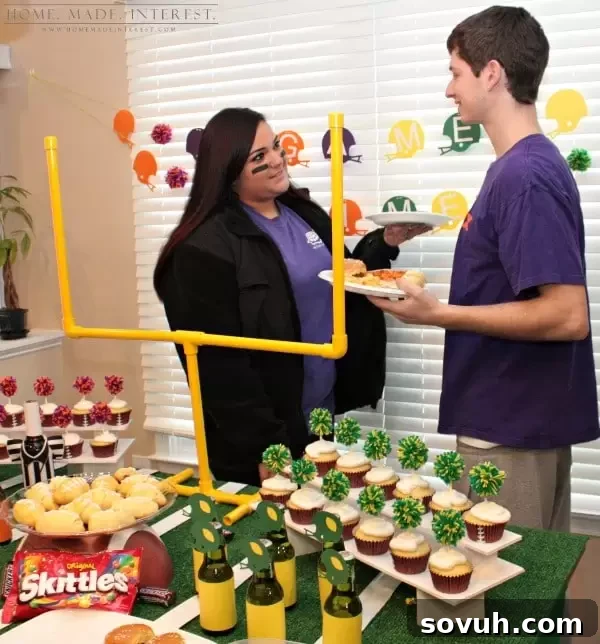 Friends and family enjoying a vibrant Game Day party with themed decorations and delicious snacks.